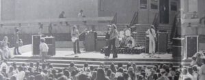 Old black and white photoe of Van Halen on stage in 1976